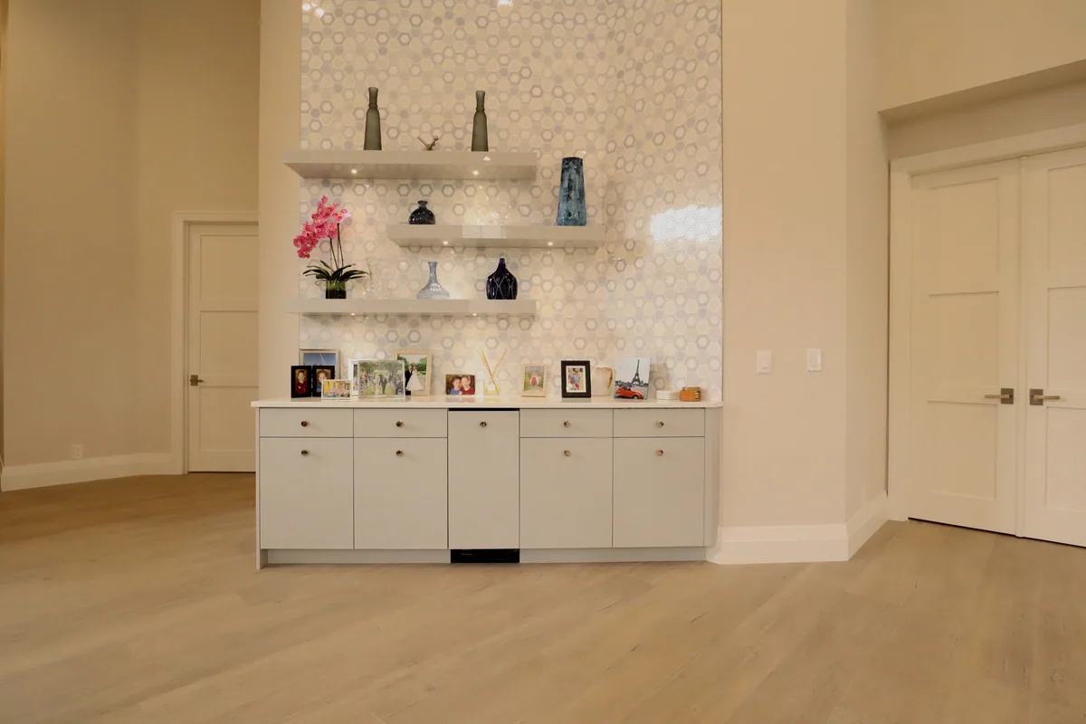 Built-in coffee bar credenza with open display shelving and tile backsplash