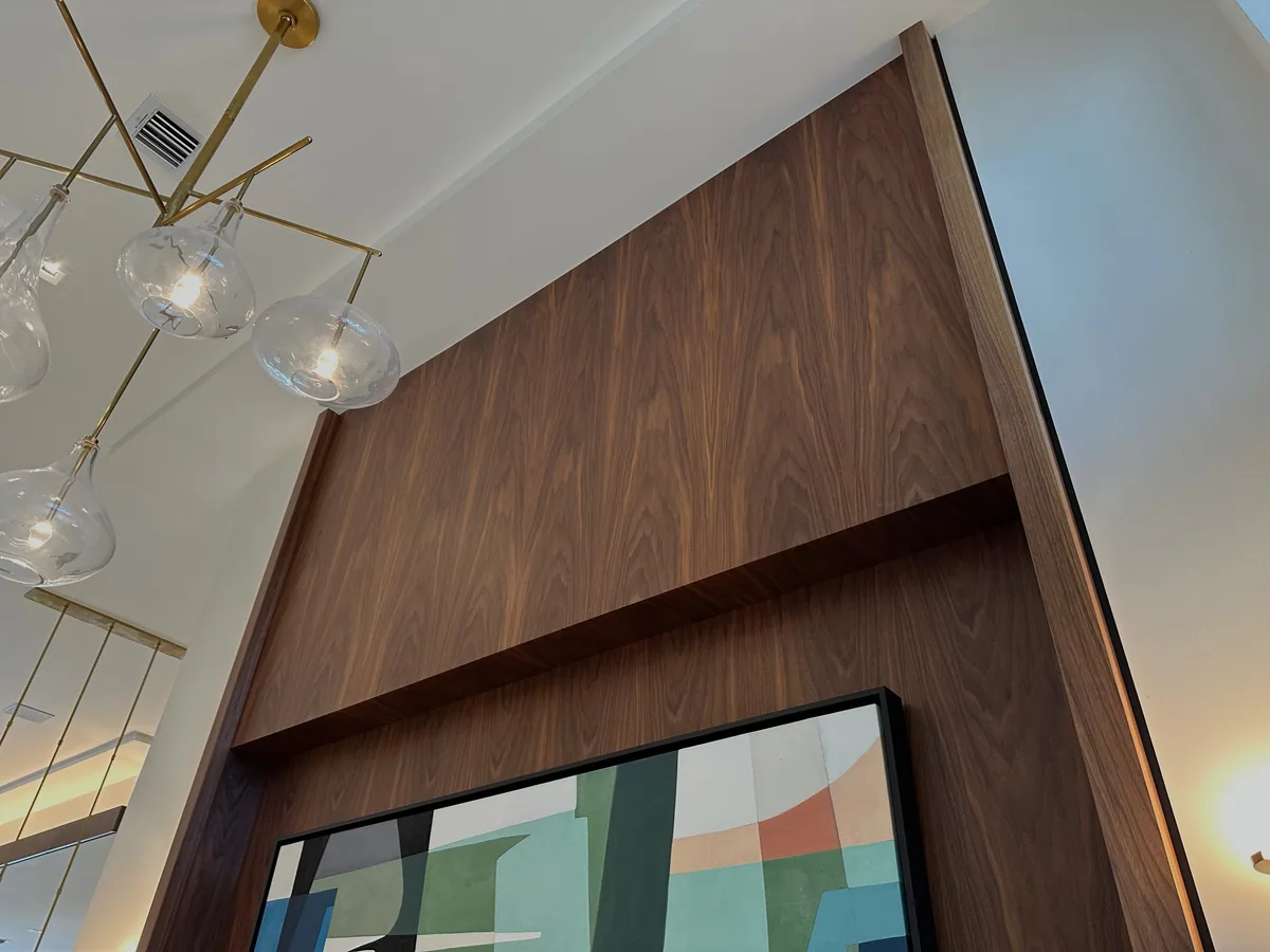 Architectural feature wall in angled walnut veneer panelling, Palm Beach County residence, Jupiter FL