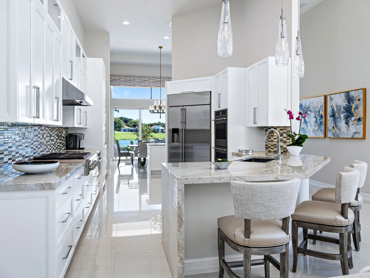 Custom white shaker kitchen with stainless hood